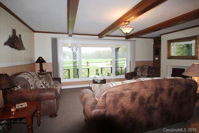 1424 Tot Dellinger Road Cherryville, NC 28021 - Photo 3 of 24 a bed room with a bed and a large window