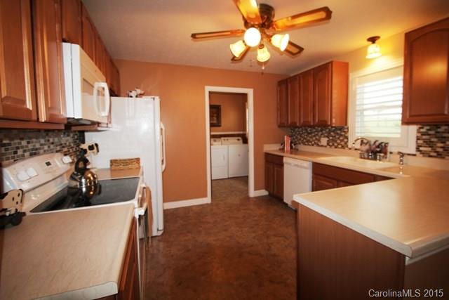 1424 Tot Dellinger Road Cherryville, NC 28021 - Photo 9 of 24 a kitchen with refrigerator a stove a sink and dishwasher
