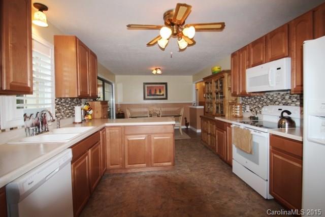 1424 Tot Dellinger Road Cherryville, NC 28021 - Photo 10 of 24 a kitchen with a sink cabinets and window