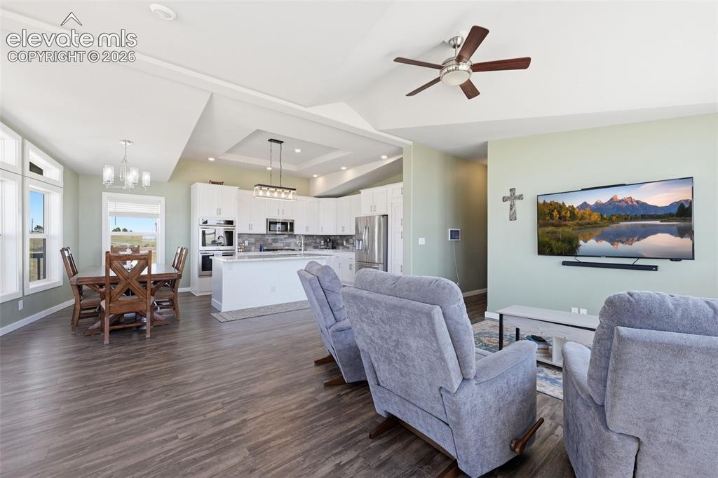 23335 Sanborn Road Calhan, CO 80808 - Photo 10 of 28 Bright and open living spaces with seamless indoor/outdoor flow
