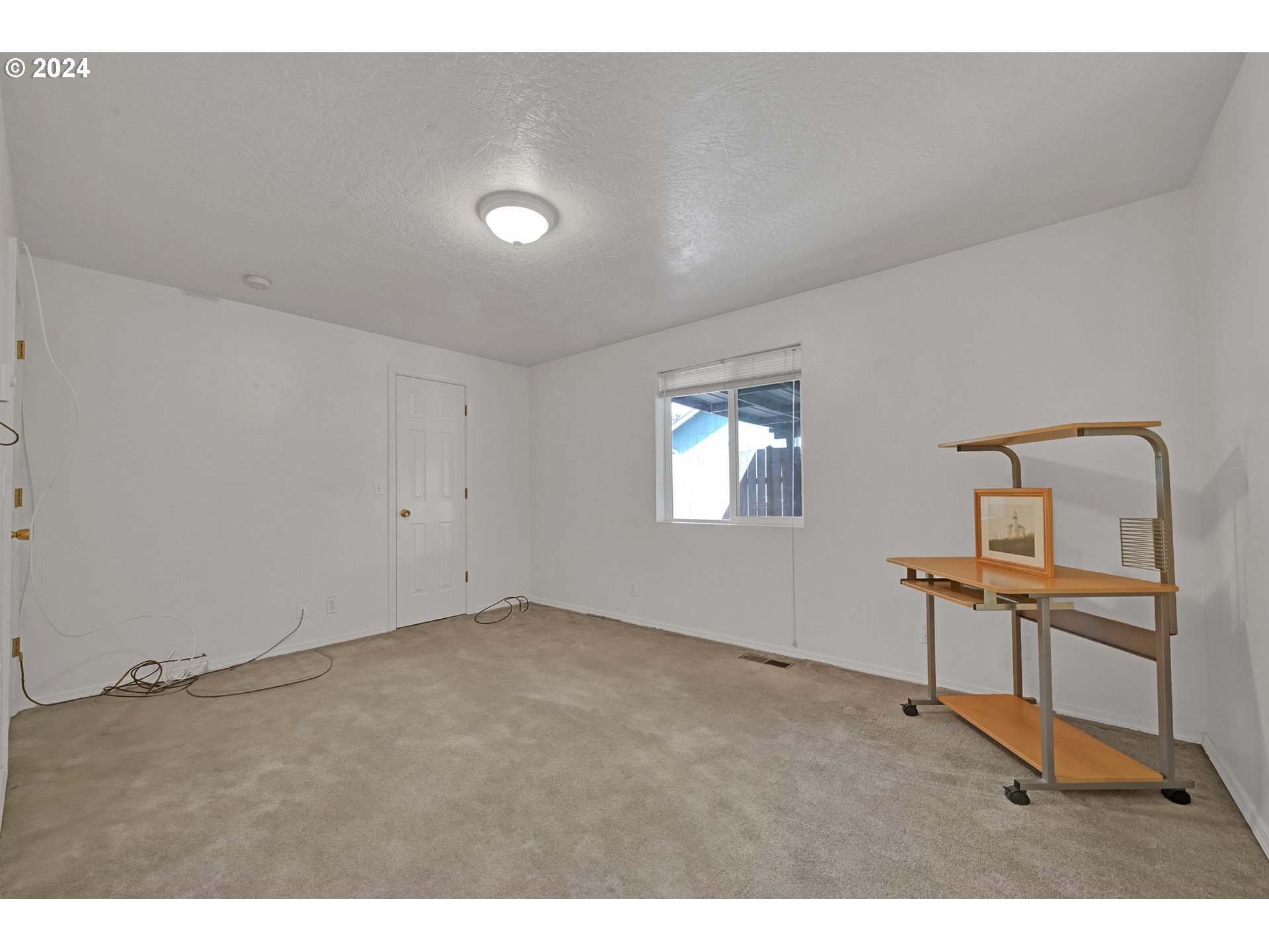 870 Hazelnut Lane Springfield, OR 97478 - Photo 17 of 35 a view of an empty room and a window