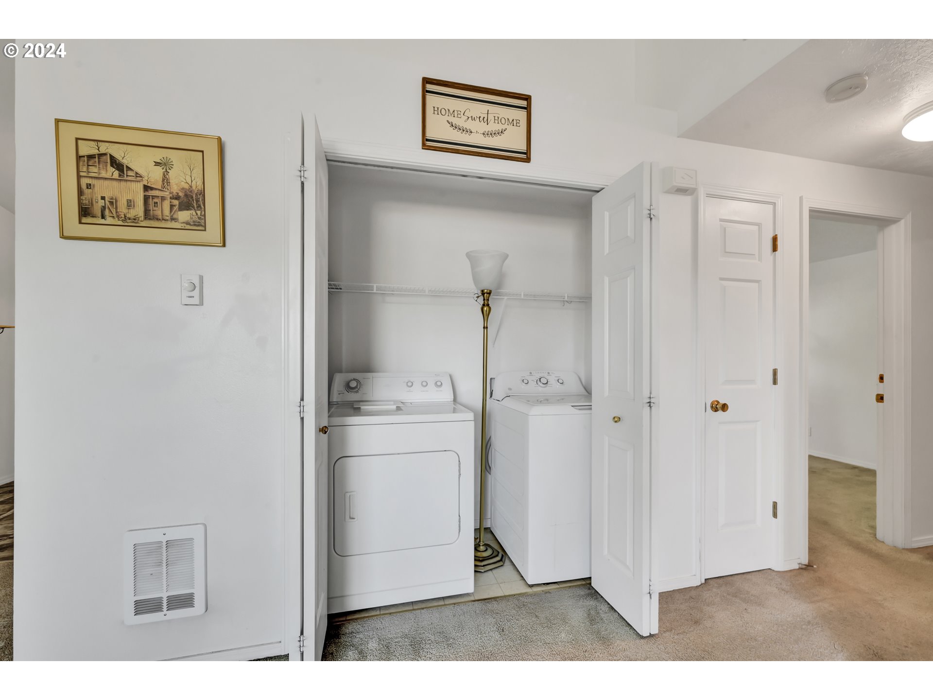 870 Hazelnut Lane Springfield, OR 97478 - Photo 20 of 35 a view of a hallway with closet and washer