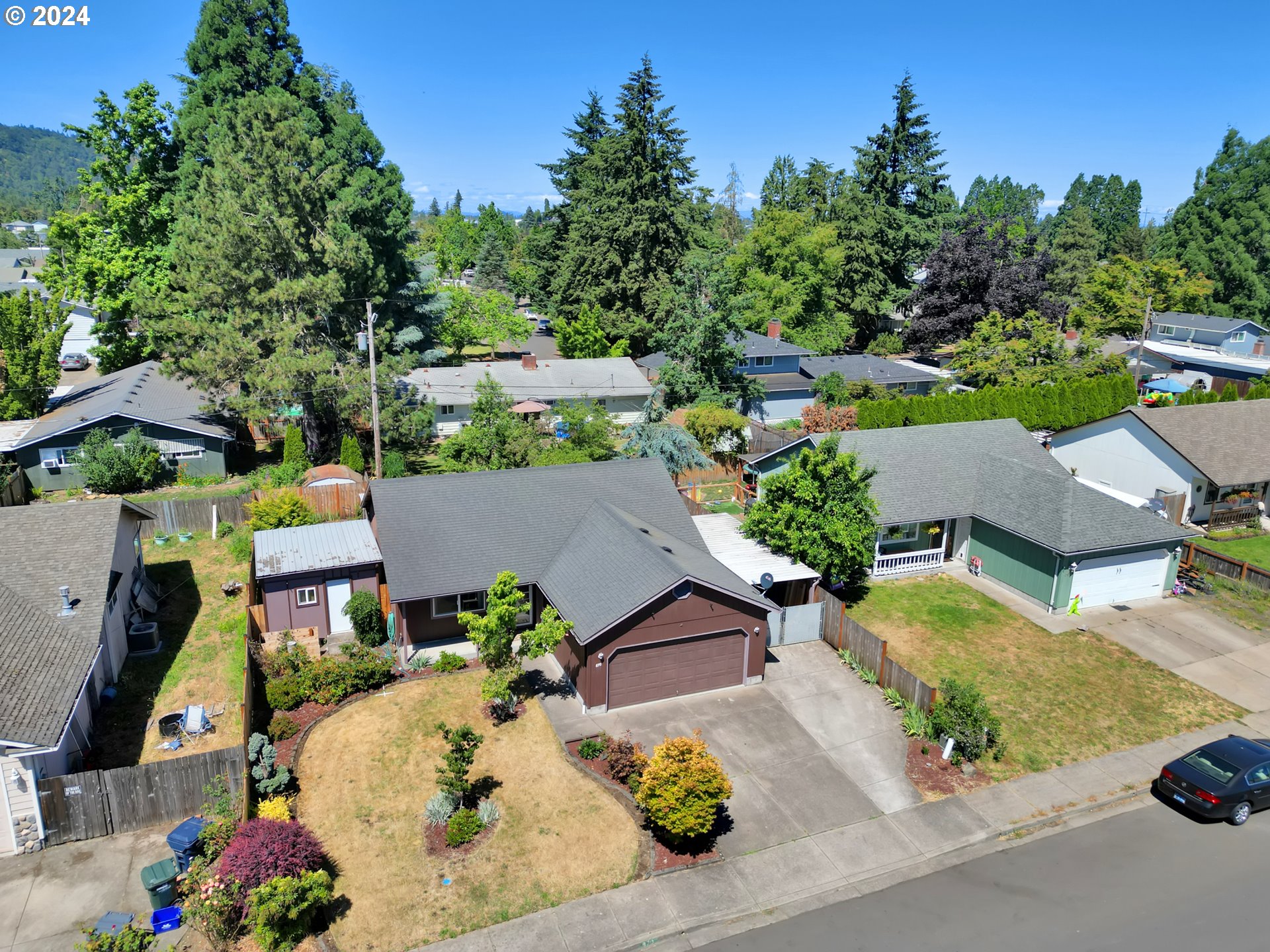870 Hazelnut Lane Springfield, OR 97478 - Photo 3 of 35 an aerial view of a house with a garden