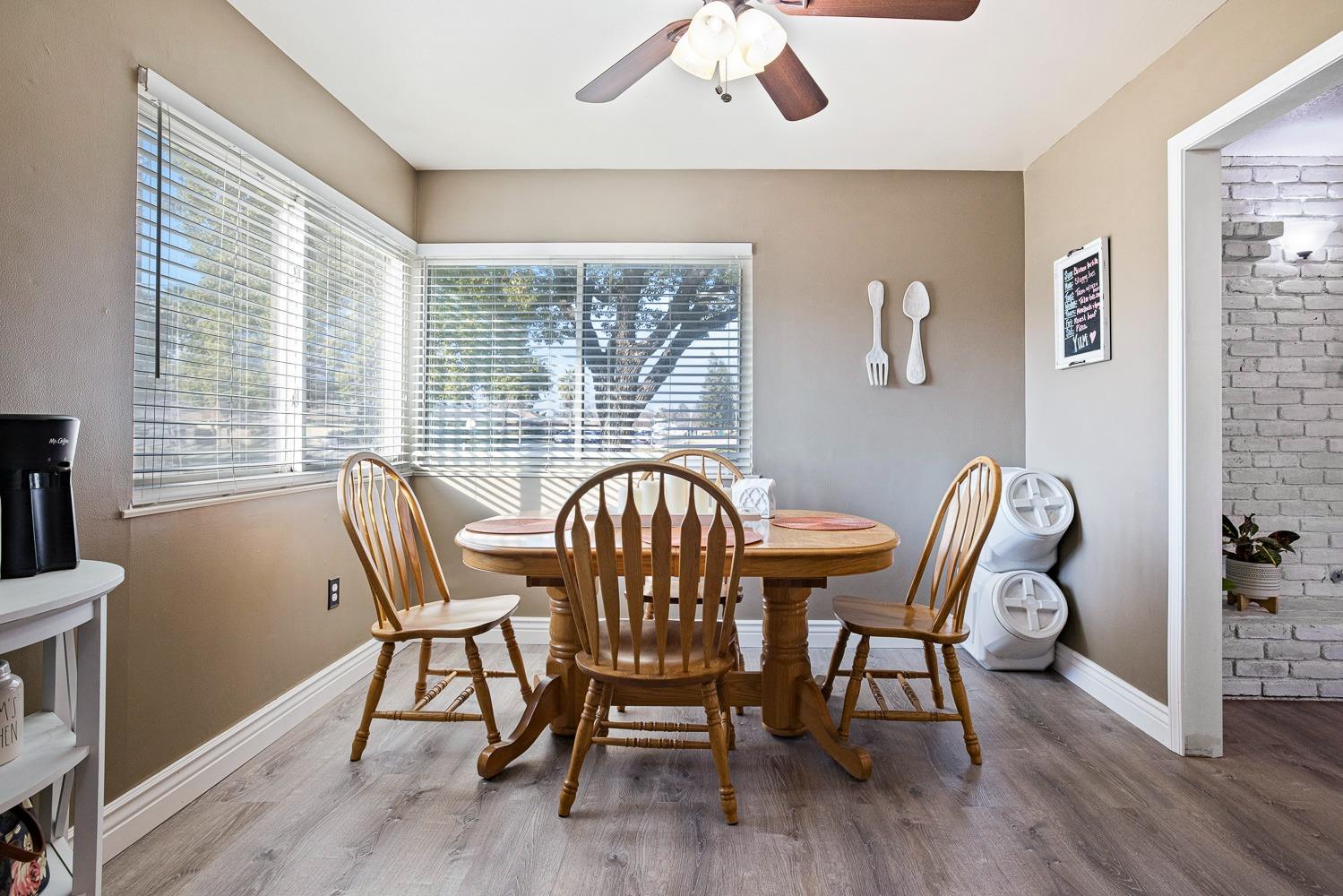 5780 North Angus Street Fresno, CA 93710 - Photo 15 of 41 a view of a dining room with furniture window and wooden floor