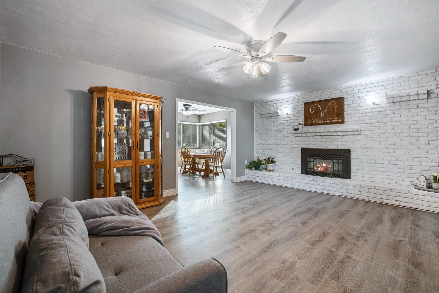 5780 North Angus Street Fresno, CA 93710 - Photo 20 of 41 a living room with furniture and a fireplace