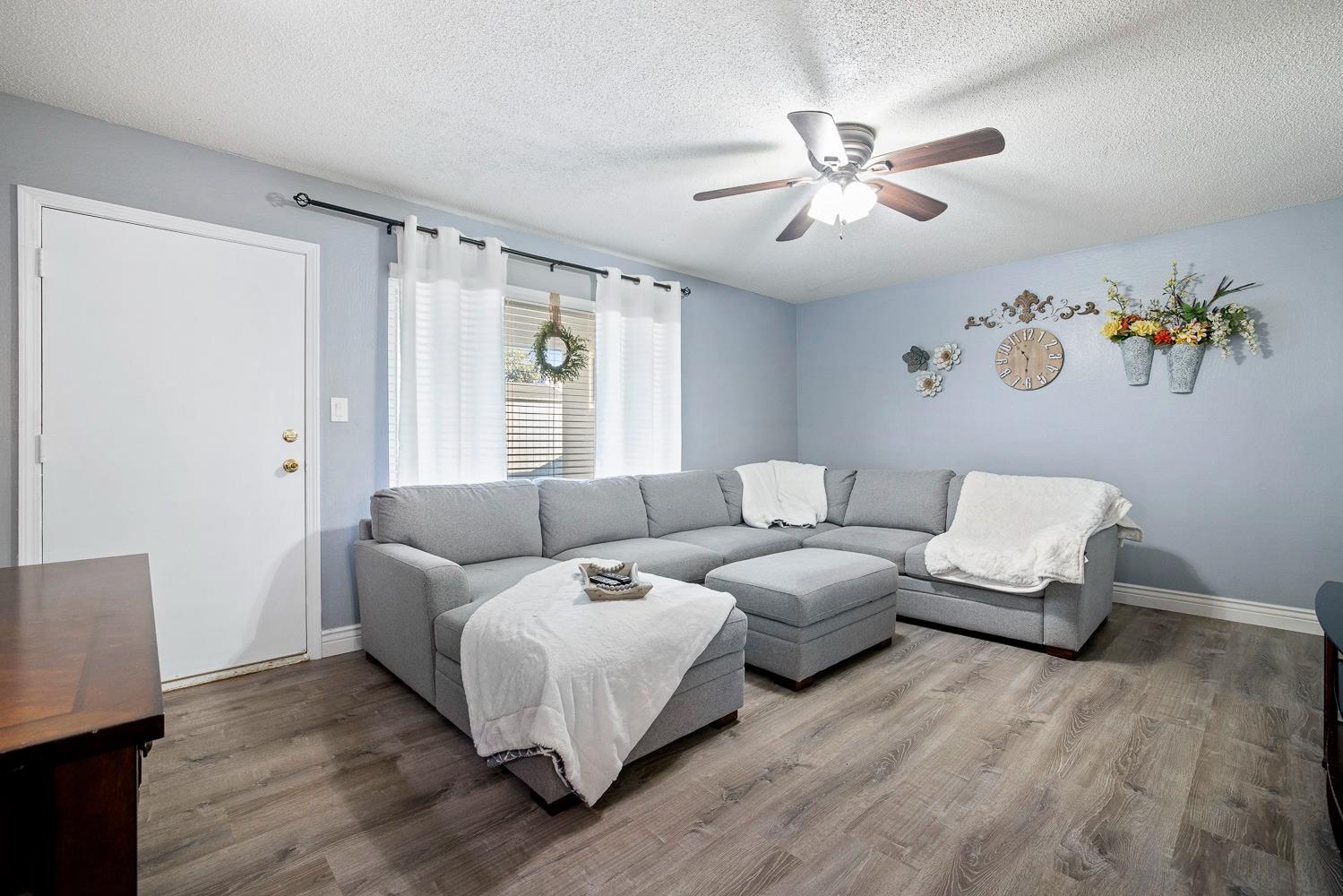 5780 North Angus Street Fresno, CA 93710 - Photo 25 of 41 a living room with furniture and a window