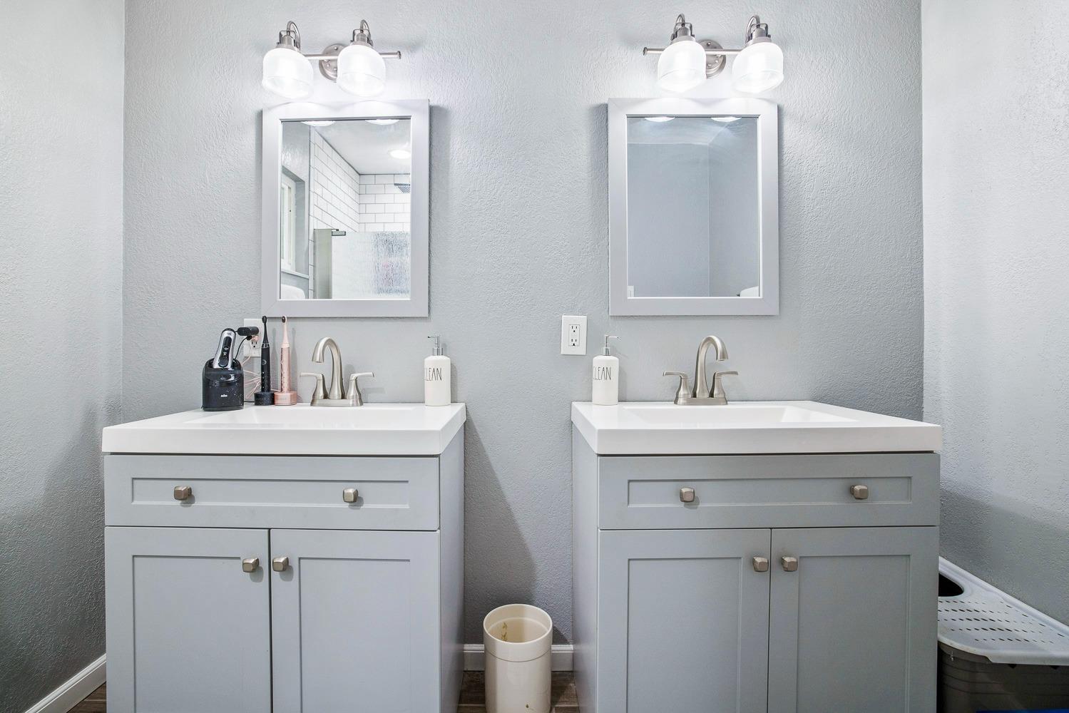 5780 North Angus Street Fresno, CA 93710 - Photo 35 of 41 a bathroom with a sink mirror and vanity