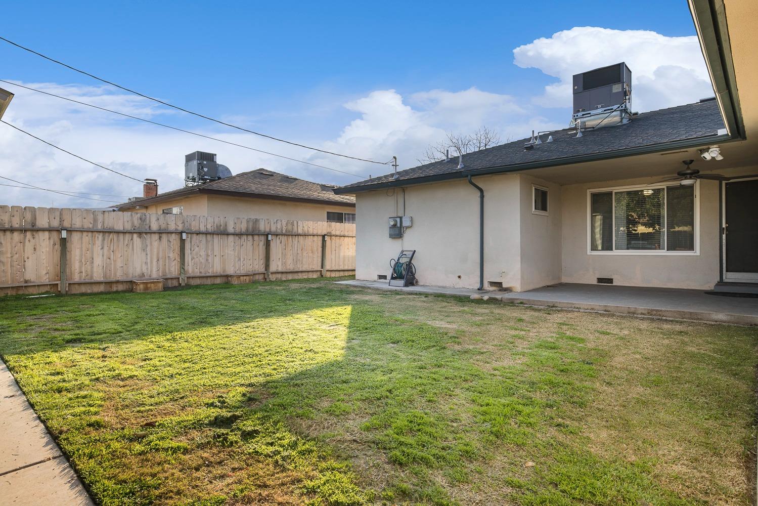 5780 North Angus Street Fresno, CA 93710 - Photo 38 of 41 a view of a house with a yard