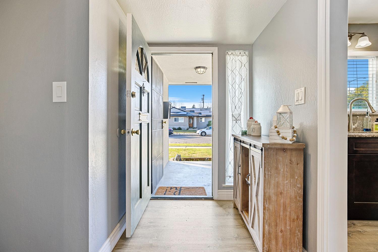 5780 North Angus Street Fresno, CA 93710 - Photo 7 of 41 a view of a bathroom from a hallway