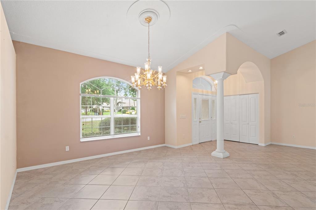 1617 Southeast 29th Terrace Ocala, FL 34471 - Photo 14 of 42 a view of a chandelier in big room and chandelier fan