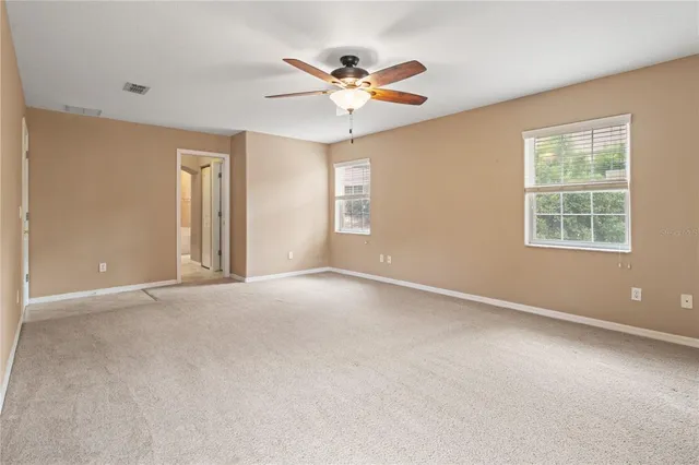 a bathroom with a bathtub sink and mirror