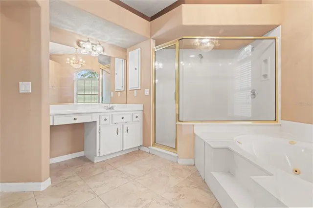 an empty room with a cabinet and mirrors