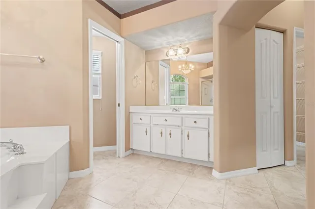 a view of spacious bathroom with a bathtub and shower