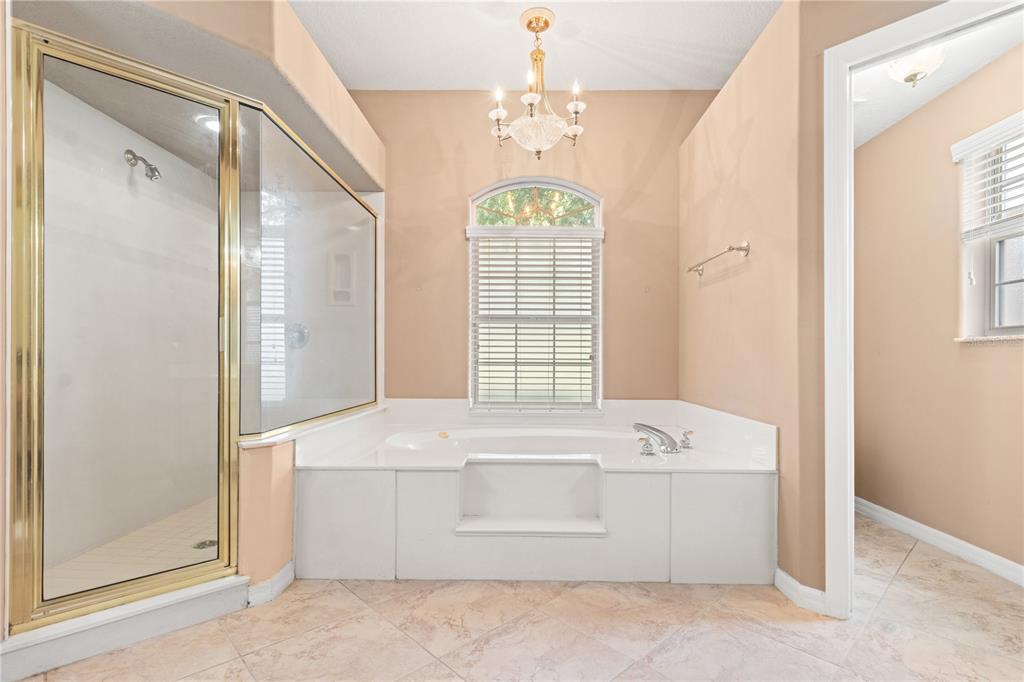 1617 Southeast 29th Terrace Ocala, FL 34471 - Photo 20 of 42 a view of spacious bathroom with a bathtub and shower