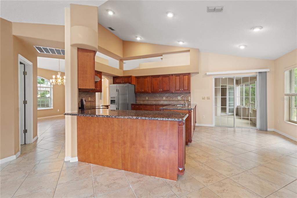 1617 Southeast 29th Terrace Ocala, FL 34471 - Photo 25 of 42 a view of kitchen with kitchen island a counter top space a sink stainless steel appliances and cabinets