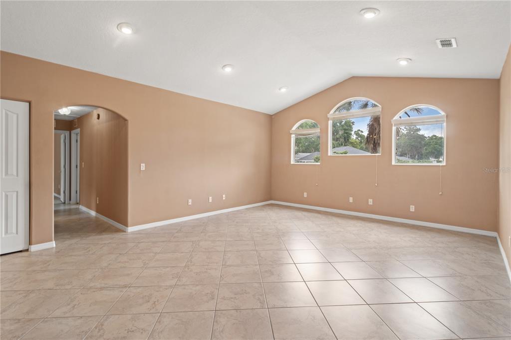 1617 Southeast 29th Terrace Ocala, FL 34471 - Photo 28 of 42 an empty room with windows and fan