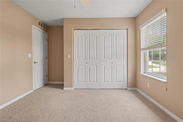 a room with a cabinets and washer