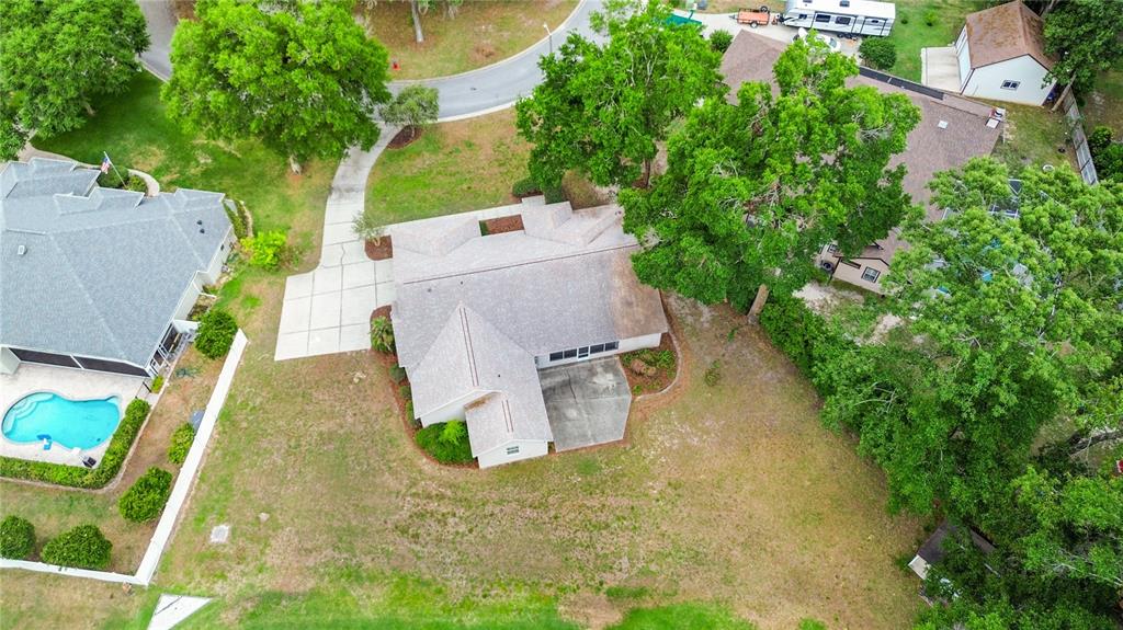 1617 Southeast 29th Terrace Ocala, FL 34471 - Photo 40 of 42 an aerial view of a house with swimming pool and large trees