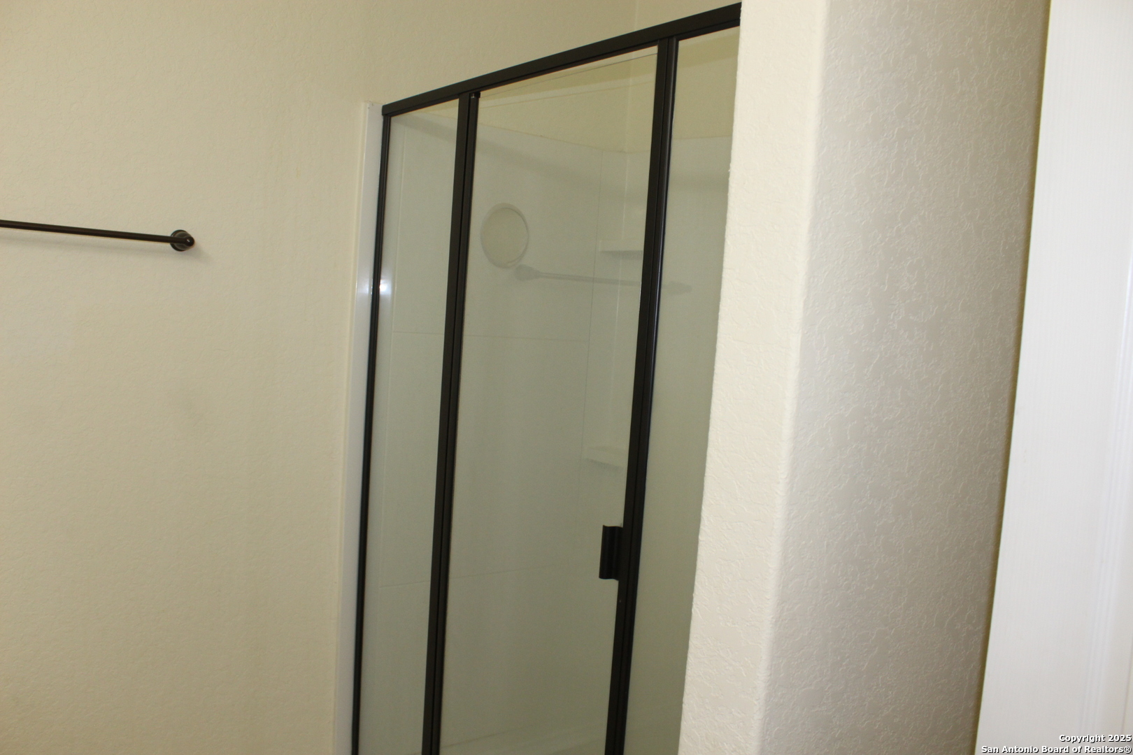 482 Walnut Crest Selma, TX 78154 - Photo 15 of 19 a bathroom with a glass shower door
