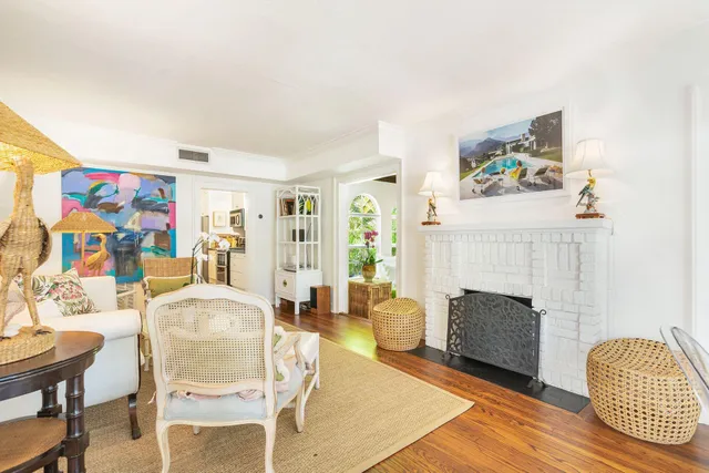 a view of entryway livingroom and hall with wooden floor