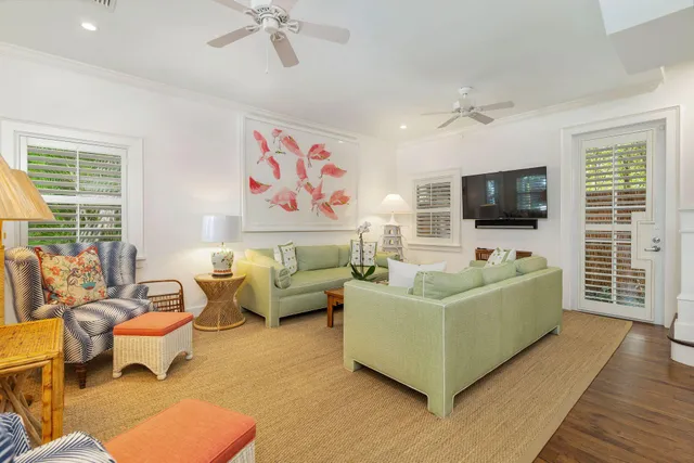 a view of a patio with table and chairs under an umbrella