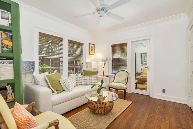 a view of two chairs in the balcony