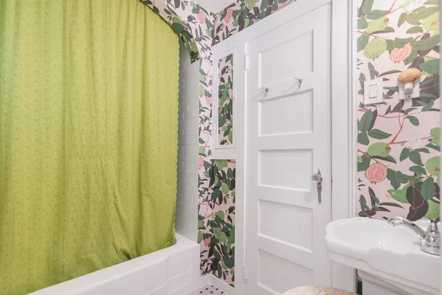 a view of a pathway with a tree