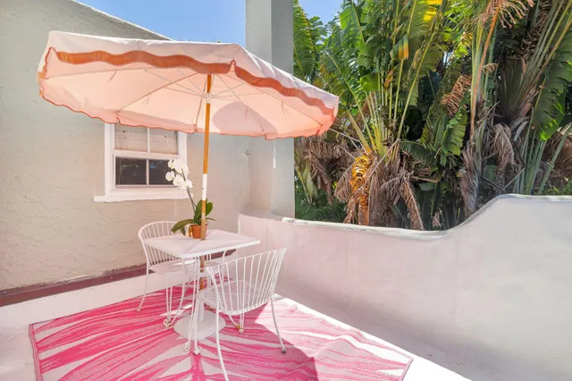 an aerial view of multiple houses with yard