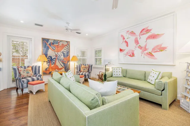a living room with fireplace furniture and a flat screen tv