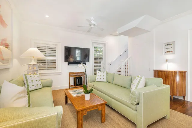 a view of a backyard with sitting area