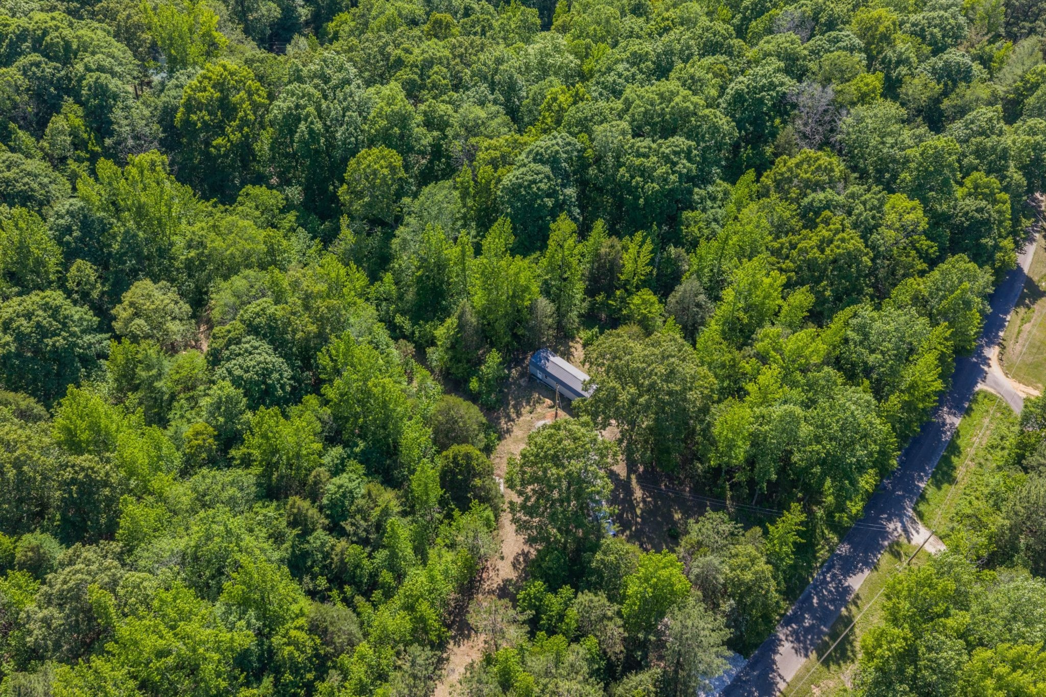 967 Little Jim Road Camden, TN 38320 - Photo 17 of 25 an aerial view of residential house with outdoor space and trees all around