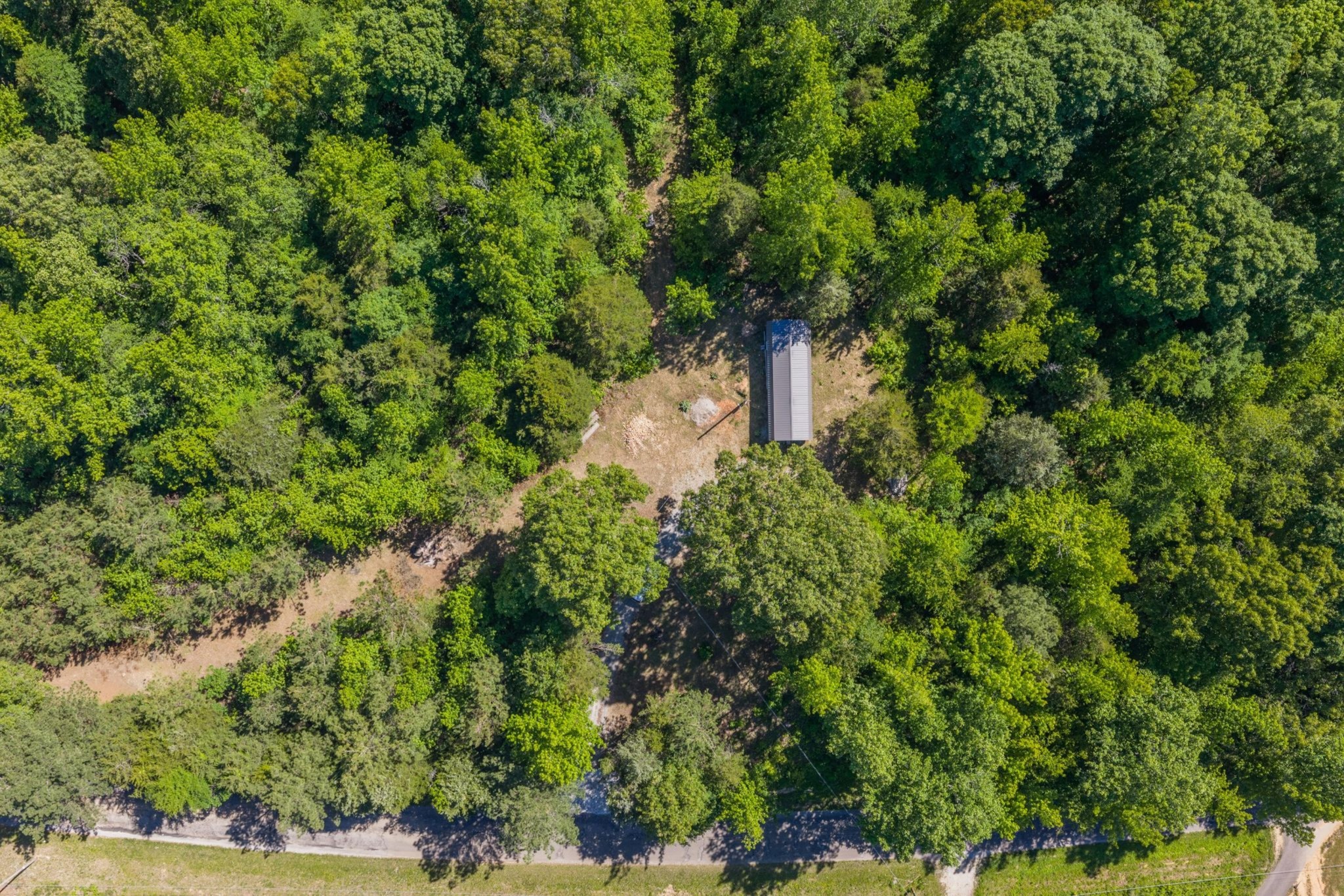 967 Little Jim Road Camden, TN 38320 - Photo 7 of 25 an aerial view of a house with yard