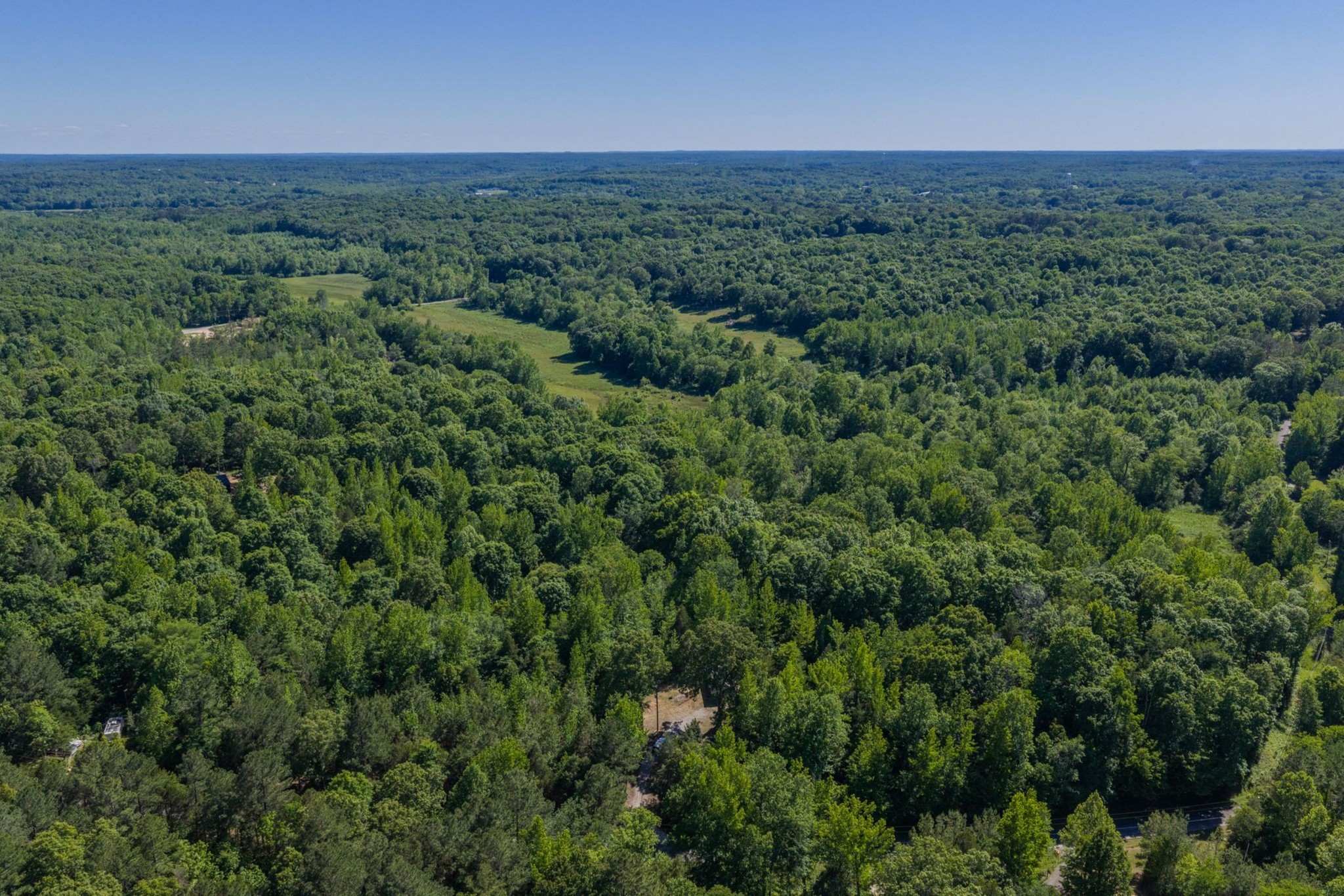 967 Little Jim Road Camden, TN 38320 - Photo 8 of 25 an aerial view of a house with outdoor space and trees all around