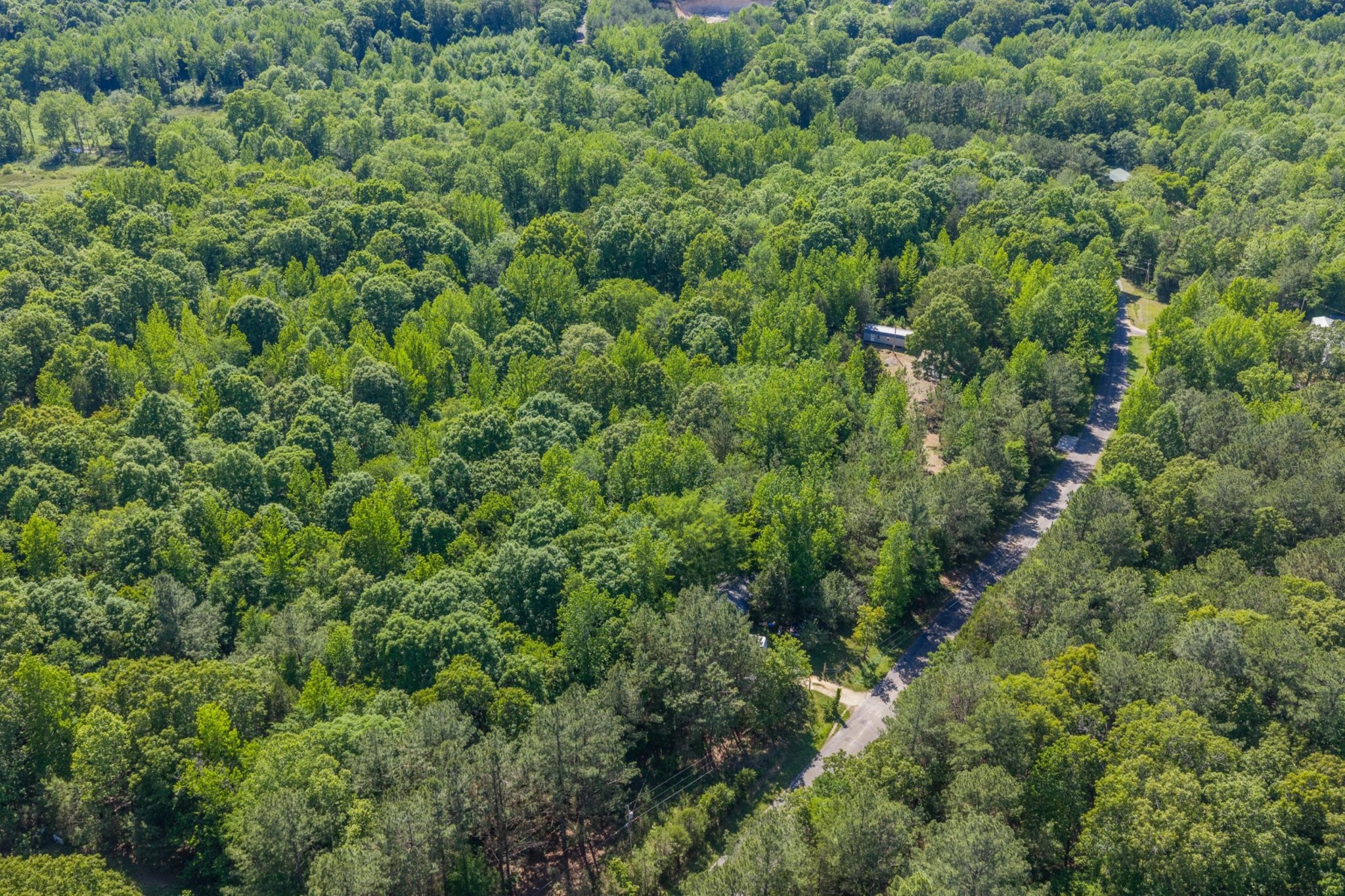967 Little Jim Road Camden, TN 38320 - Photo 9 of 25 an aerial view of residential house with outdoor space and trees all around