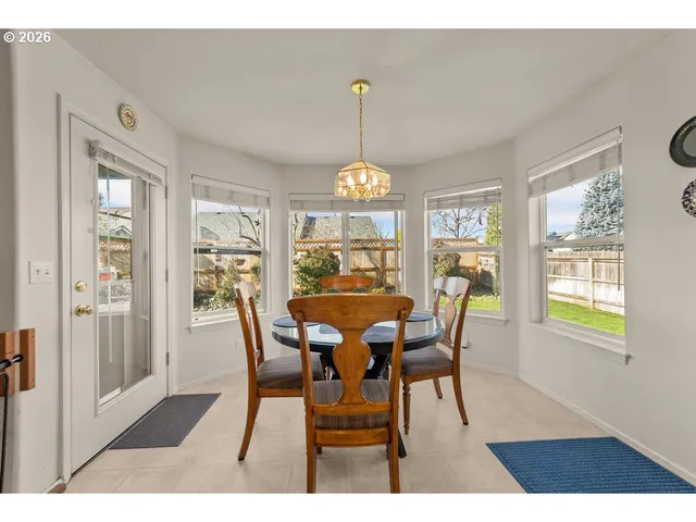 a view of a dining room with furniture window and outside view
