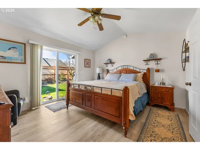 a bed room with a bed and a desk