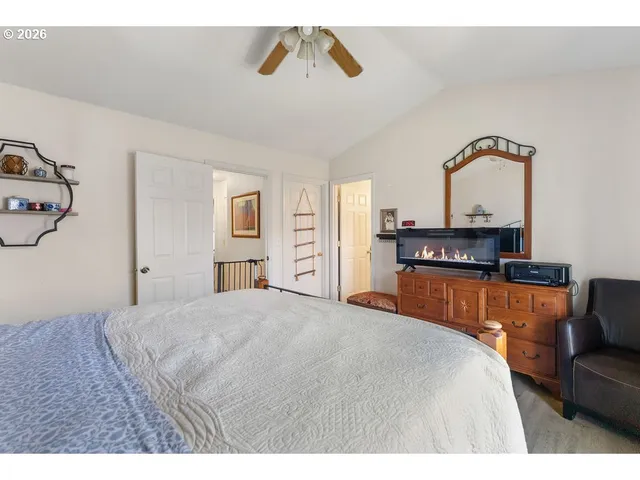 a bedroom with a bed and dresser