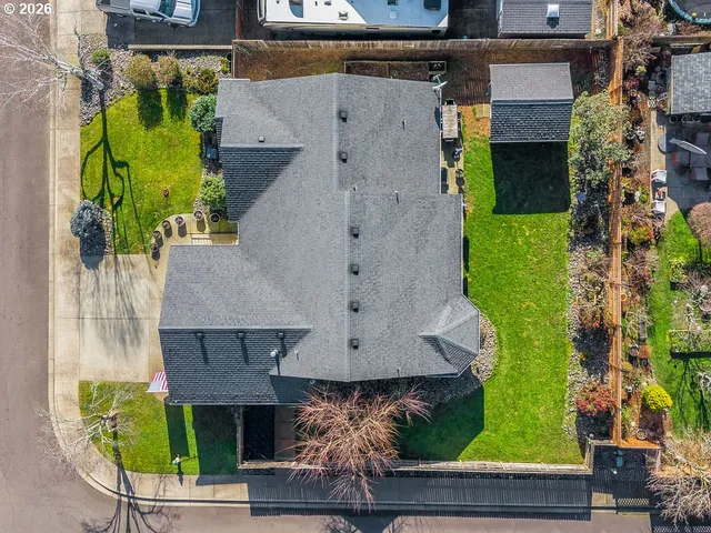 an aerial view of a house with a garden