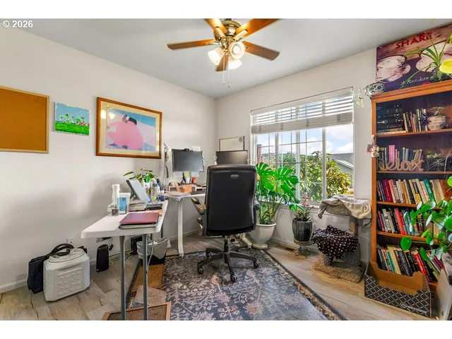 a workspace with furniture and a bookshelf