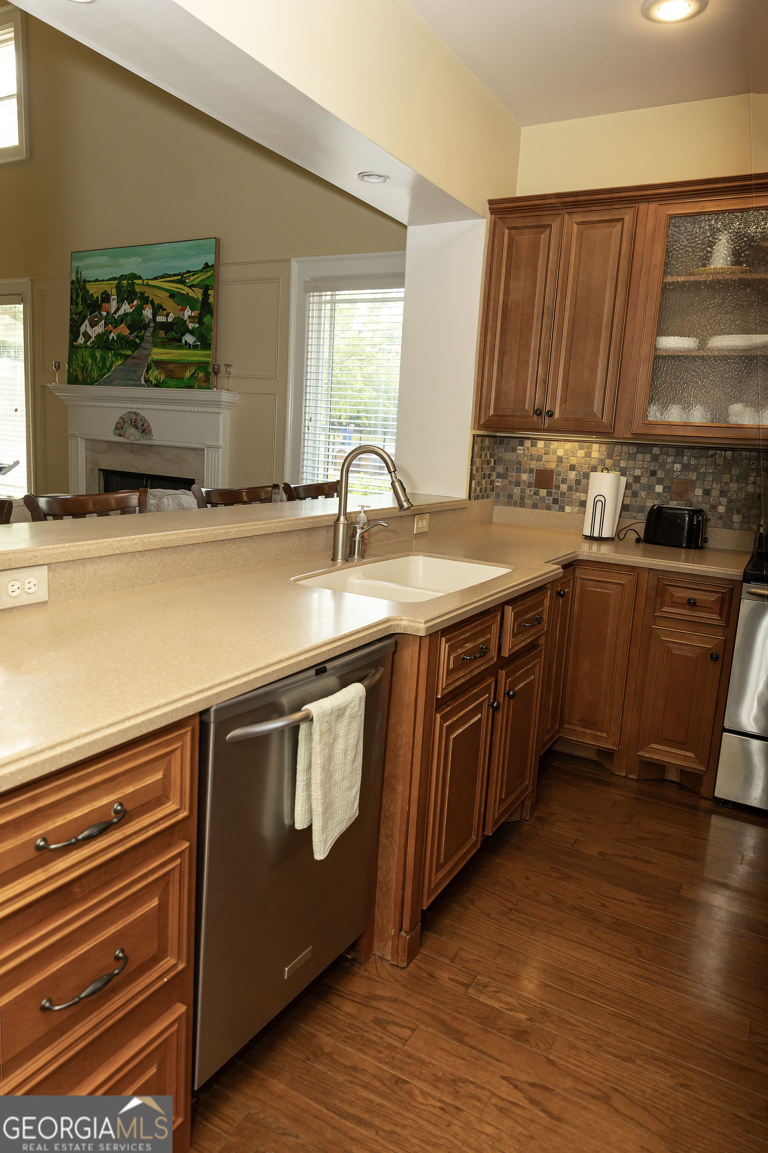102 Arbors Court Dublin, GA 31021 - Photo 15 of 33 a kitchen with stainless steel appliances granite countertop a sink stove and cabinets