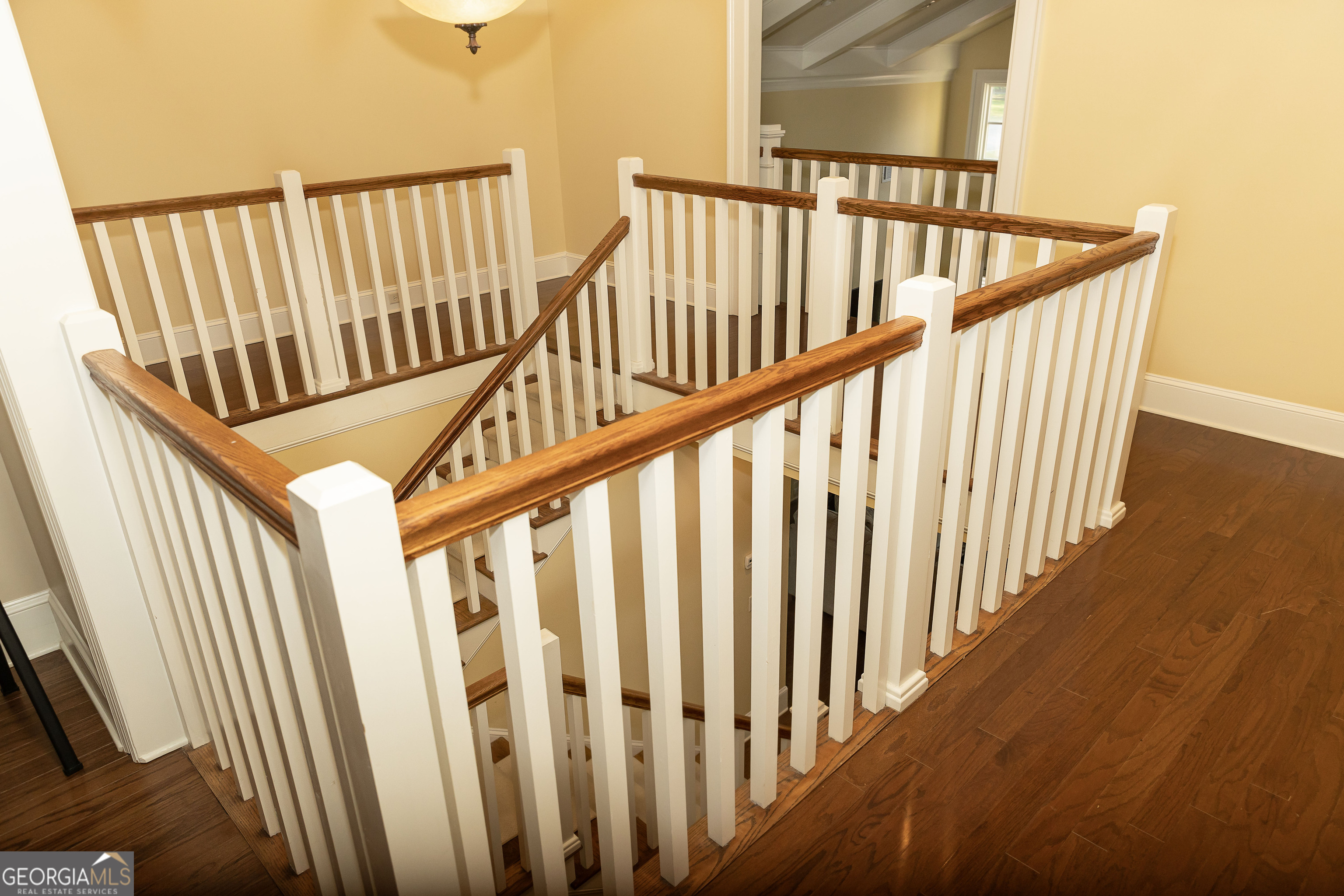 102 Arbors Court Dublin, GA 31021 - Photo 20 of 33 a view of staircase with railing and white walls