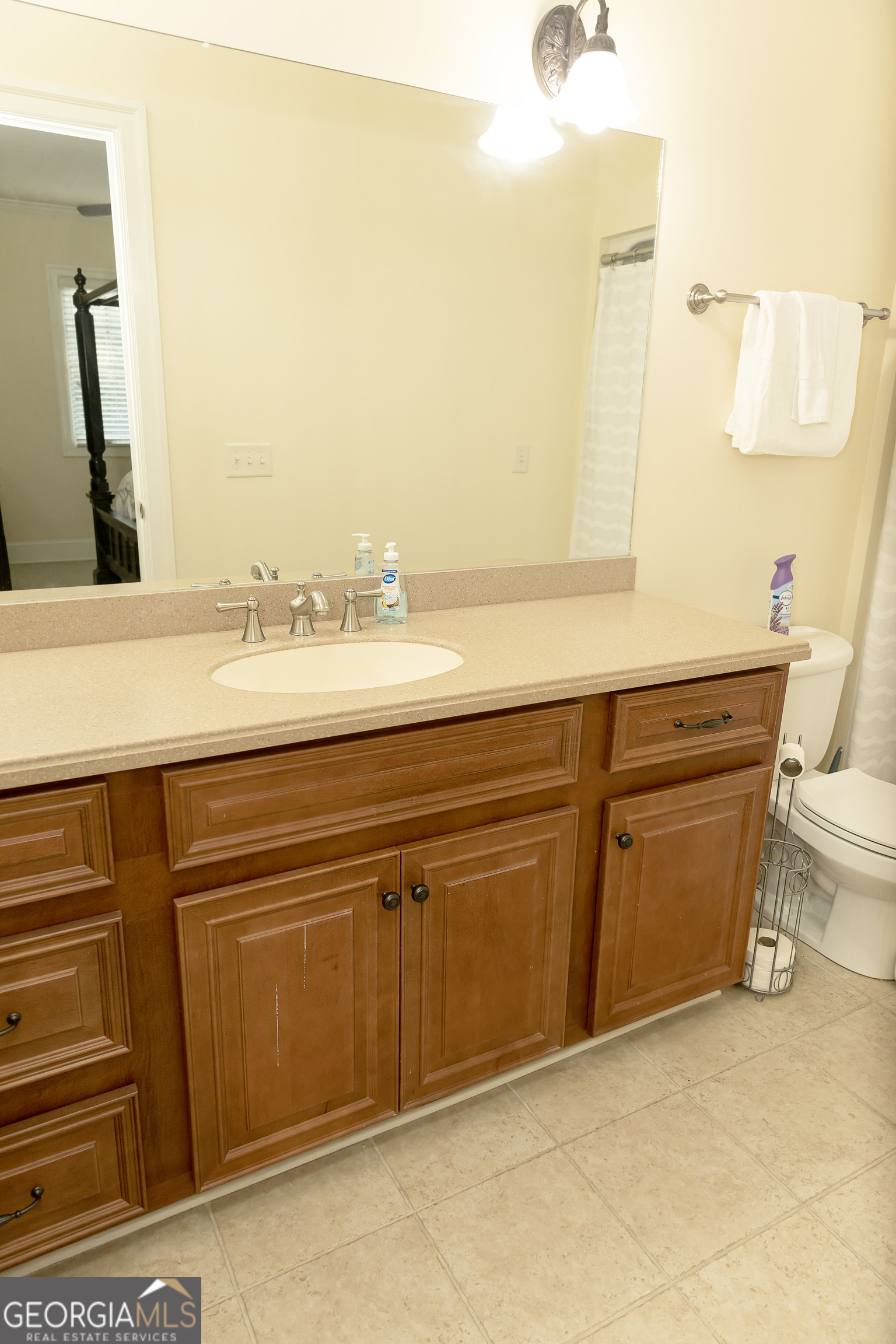 102 Arbors Court Dublin, GA 31021 - Photo 28 of 33 a bathroom with a sink and a mirror