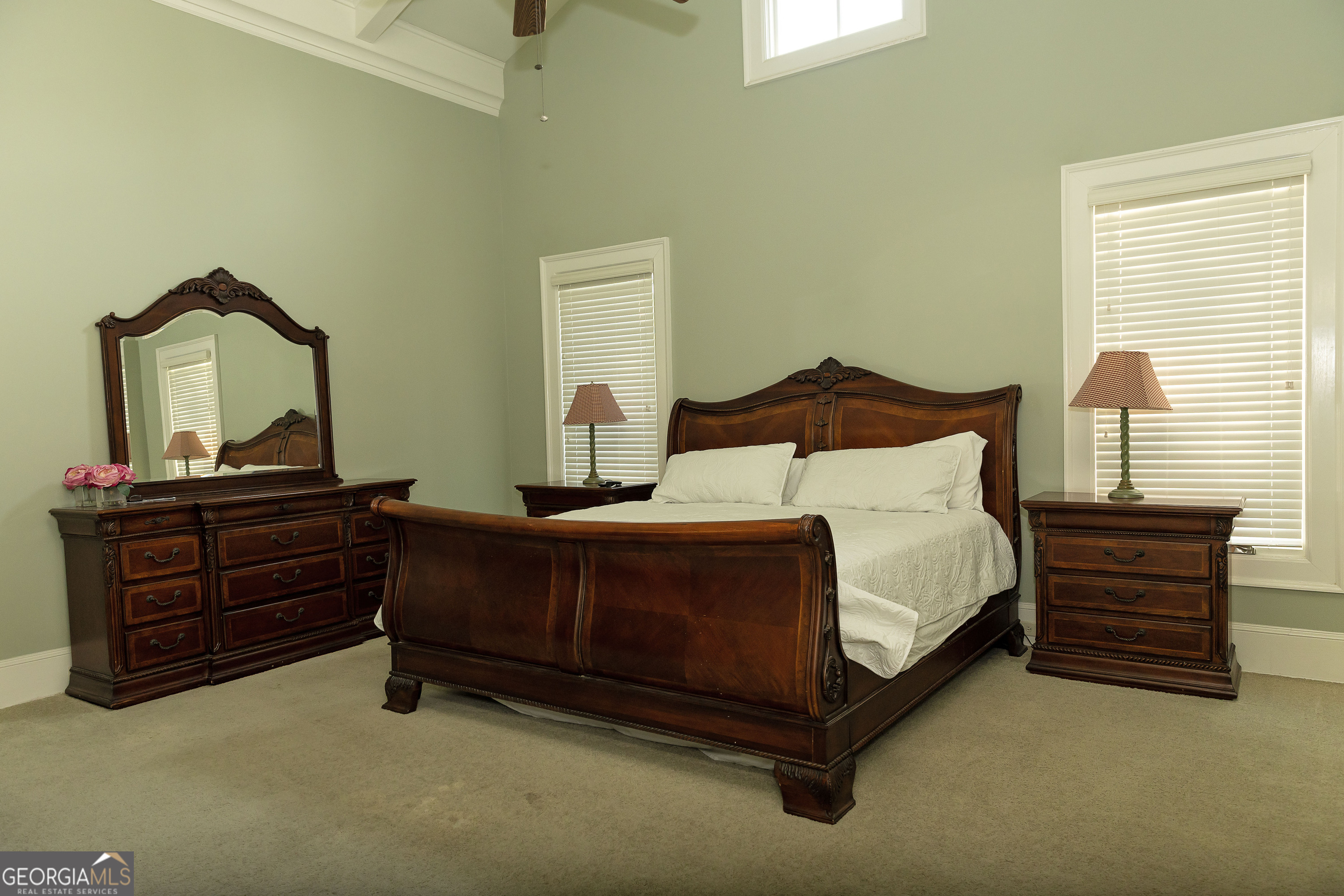 102 Arbors Court Dublin, GA 31021 - Photo 7 of 33 a bedroom with a bed and a mirror on dresser