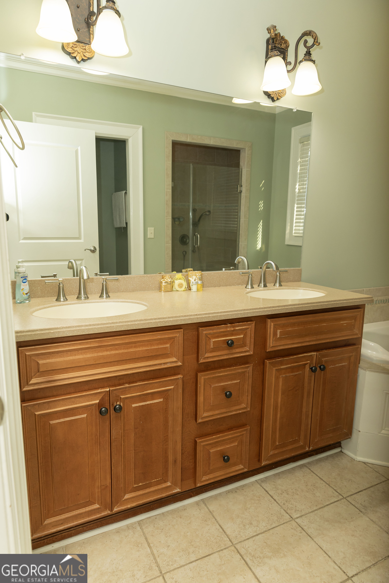 102 Arbors Court Dublin, GA 31021 - Photo 9 of 33 a bathroom with a sink and a mirror