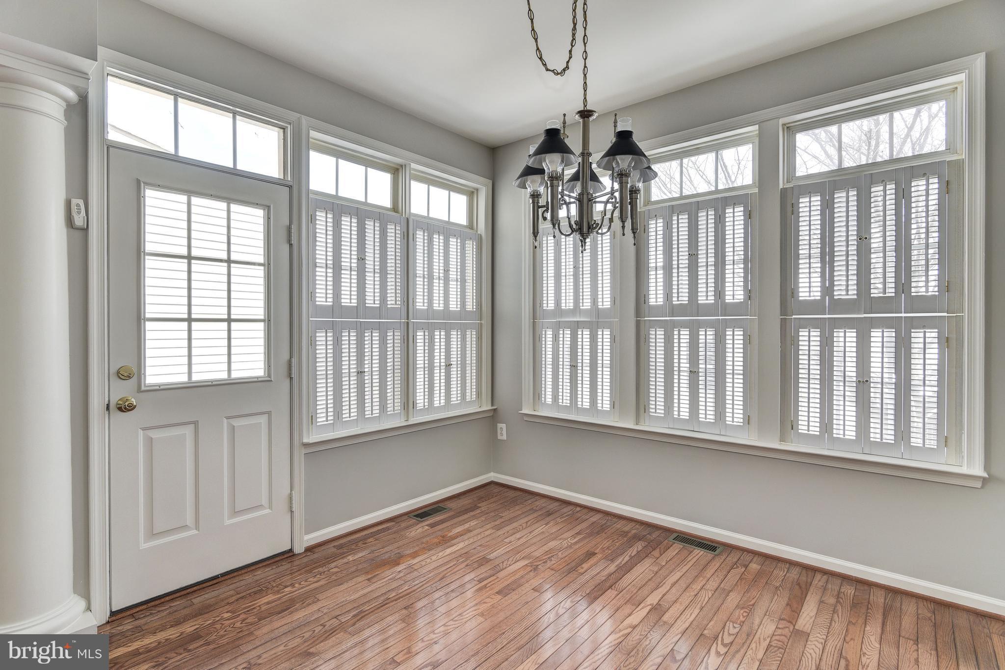 3005 Annas Terrace Frederick, MD 21701 - Photo 11 of 29 a view of an empty room with wooden floor and a window