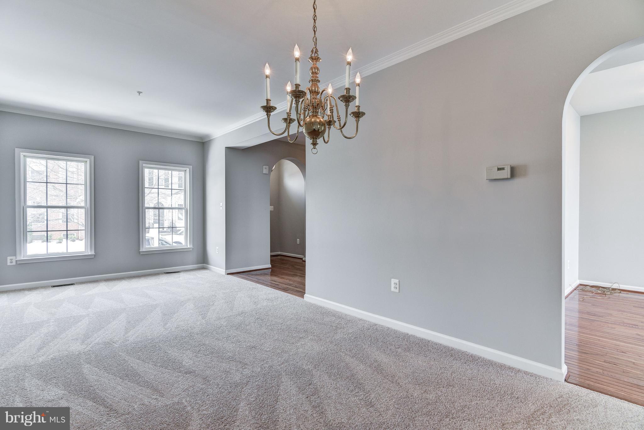 3005 Annas Terrace Frederick, MD 21701 - Photo 13 of 29 a view of a chandelier in a room with windows and chandelier