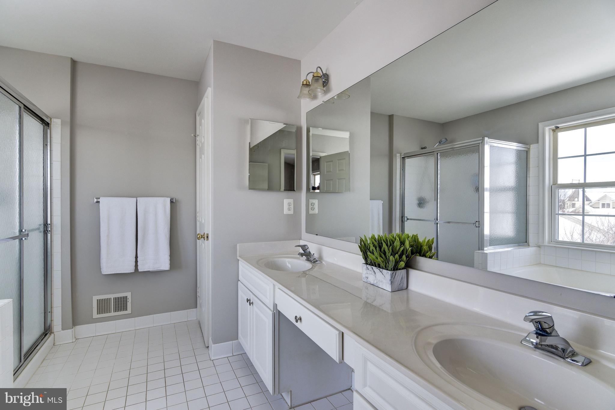 3005 Annas Terrace Frederick, MD 21701 - Photo 17 of 29 a bathroom with a double vanity sink and mirror