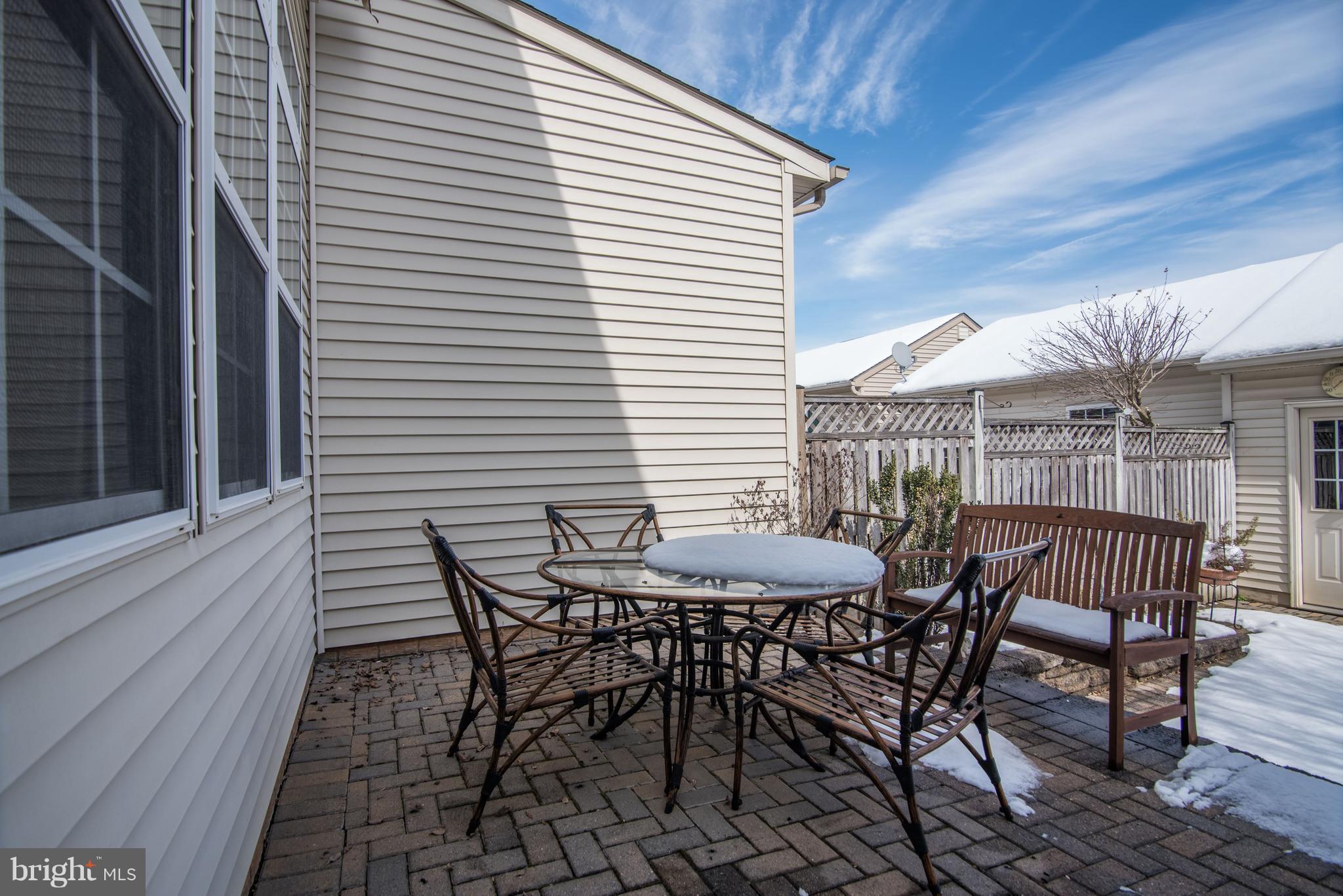 3005 Annas Terrace Frederick, MD 21701 - Photo 24 of 29 a view of a roof deck with table and chairs and wooden floor