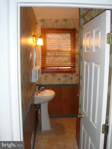a bathroom with a sink and mirror