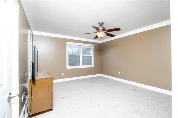 a view of an empty room with a window